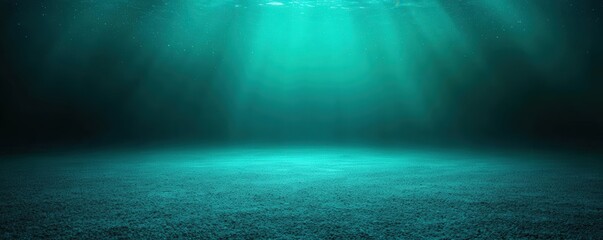 Fototapeta premium Underwater scene with sunlight rays penetrating deep blue water, illuminating the ocean floor covered with small pebbles.