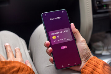 Woman using smartphone for online shopping with payment later. Buy now pay later online shopping...