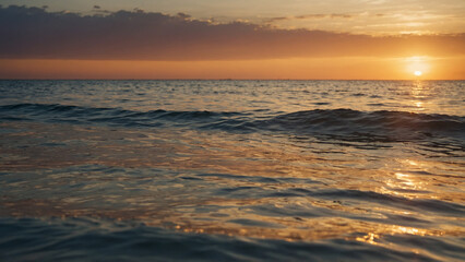 Bright sun melting into the sea horizon with glowing summer tones reflected in soft waves and blurred foreground elements this view showcases the sun’s texture and light gradient in