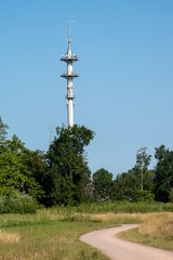 Obraz premium Telecommunication tower standing tall in lush green landscape