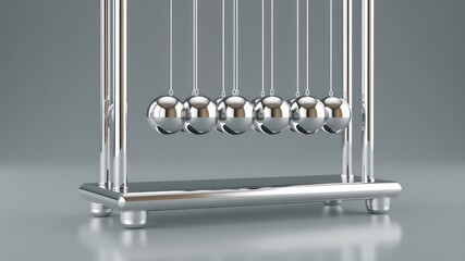 Shiny metallic spheres suspended in a row, demonstrating momentum, balance and energy conservation in physics