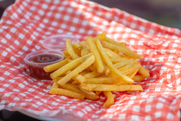 French fries and two sauces in containers