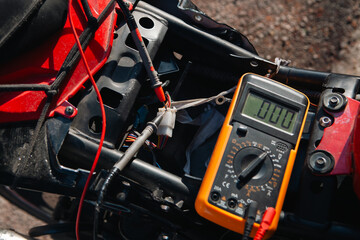 Obraz premium electric motor meter with electric plug and battery for electric motor.