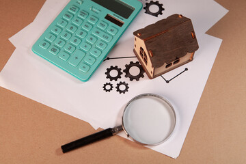 magnifying glass and calculator on table. business analysis