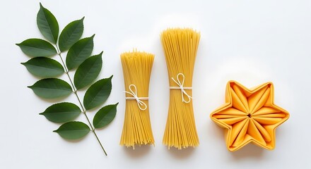 Uncooked spaghetti bundles, a green leaf sprig, and a folded star-shaped napkin on a white background.