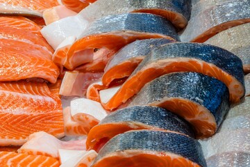 Salmon fillets and cuts, close-up view