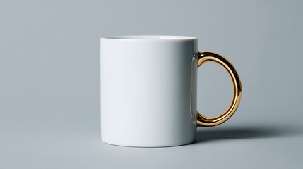 All-white mug with gold handle centered on gray background, blank design, positioned left for right-hand branding space, emphasizing simplicity and clarity in presentation.