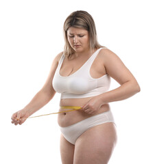 Weight loss. Plus size woman measuring waist with tape on white background