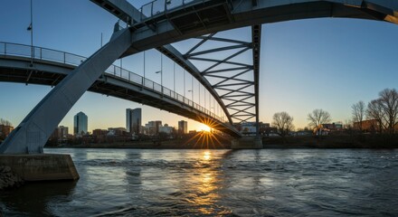 Fototapeta premium Modern bridge over river at sunset