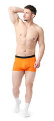 Young man in stylish orange underwear on white background