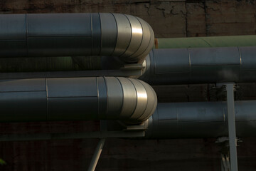 A variety of pipes are intricately connected to each other within the confines of a factory...