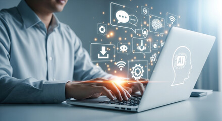 Man typing on laptop with ai interface and communication icons overlaying the screen in a bright setting