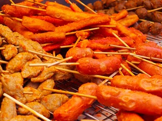 Fried red sausage sticks. Thai street food.