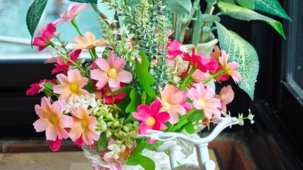 Fake plastic flower in bicycle.