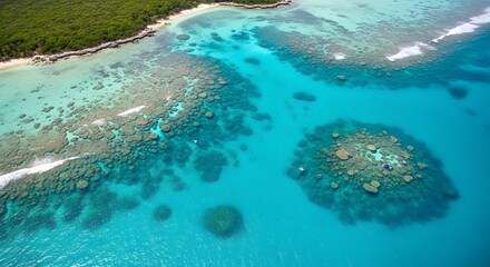 Aerial view of clear ocean water with coral reefs