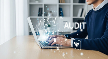 Man typing on laptop with audit graphic overlay in a bright office setting with white bookshelves