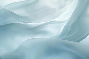 Fototapeta premium Abstract composition of draped, sheer fabric in light blue and white, with soft lighting and flowing curves.