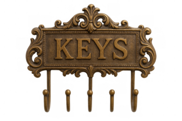 Metal key holder with decorative frame and five hooks, isolated on transparent background, perfect for home organization