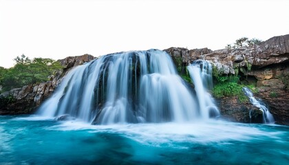 serene blue waterfall cascading over rock formation cut out stock
