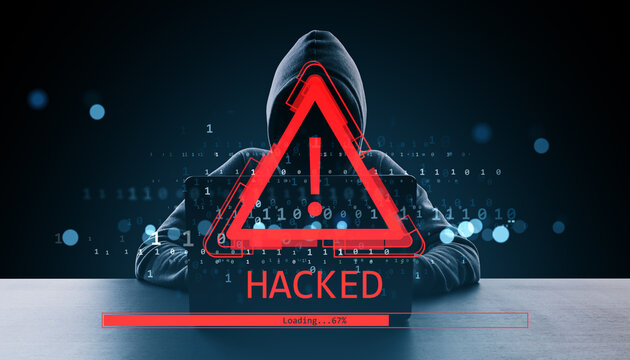 Hacker in hoodie with red warning exclamation icon and "HACKED" alert on digital screen in dark background with binary code and loading bar.