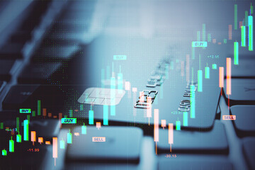 Digital financial market chart overlay on credit card and keyboard background illustrating fintech investment and currency trading concept.