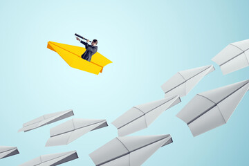 Businessman leading with vision on yellow paper plane among white planes on light background,...
