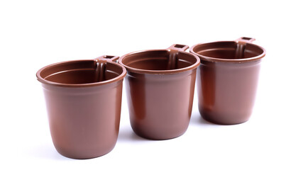 Brown plastic cups isolated on white background