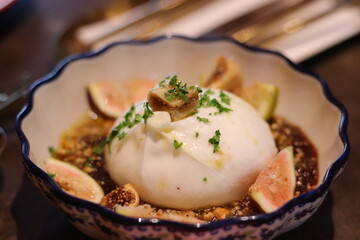 Fresh fig and mozzarella cheese appetizer on plate