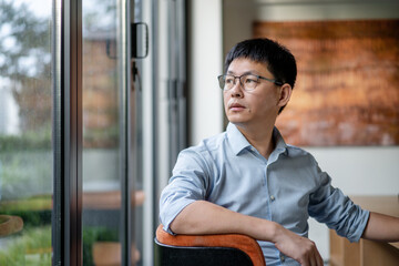 asian businessman sitting in office