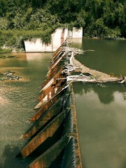 Decaying Dam Structure in Lush Green Foliage Awe-Inspiring Nature Photography