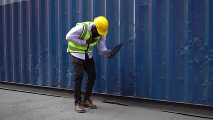 african american container worker suffers heat stroke or heart attack caucasian colleague woman helping co worker in Container Terminal Accident at workplace Safety in industrial factory.