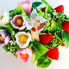 Delicate Handmade Soap Flower Bouquet on a Soft Blue Background Perfect for Gifts and Decor.