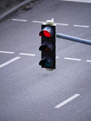A red light is lit on a street corner
