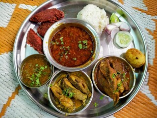 traditional Maharashtrian fish thali, likely from a 