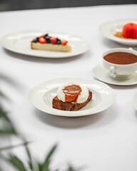 Portion of gourmet chocolate brownie dessert with syrup