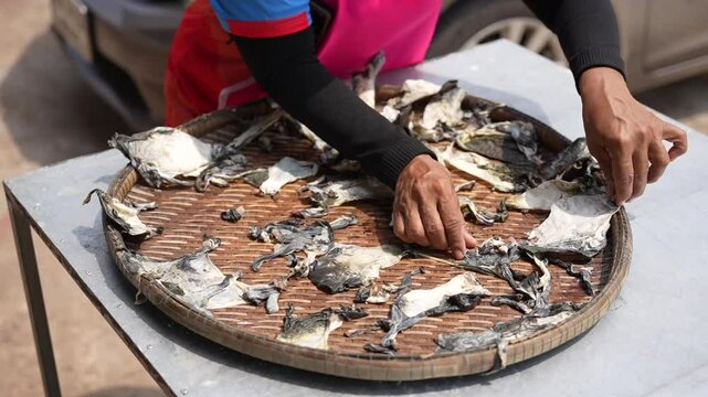 Put the frog skins out to dry in the sun before frying them.