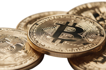Close up of several gold Bitcoin coins.