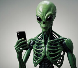 skeletal green alien using smartphone on grey background