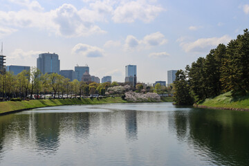 Reflection of skyscrapers in Imperial palace water pond - Tokyo