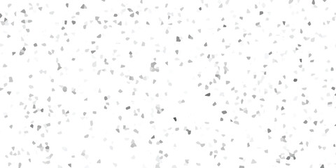 Abstract background featuring scattered gray geometric mosaic elements on white surface