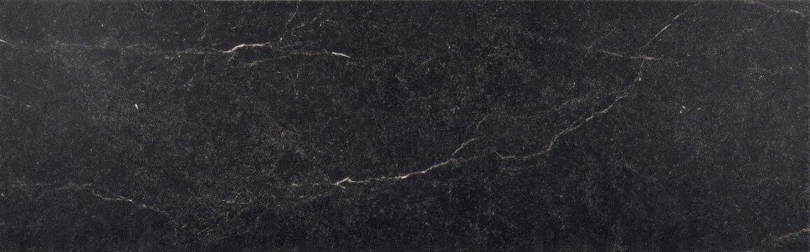 Soapstone dark black slab with detailed natural grain and faint white veining