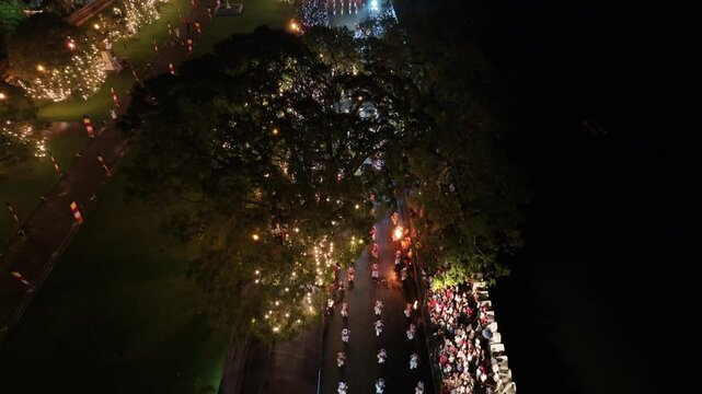 Aerial footage of the Kandy Esala Perahera, Sri Lanka&rsquo;s most iconic cultural festival. The drone captures the grand procession with traditional dancers, fire performers, drummers, and richly adorned e