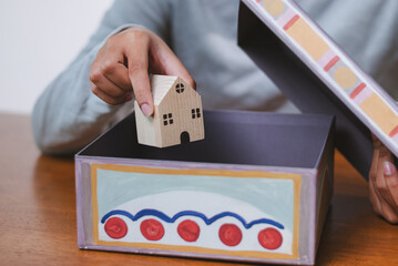 Creative organization storing a wooden house model a colorful box home indoor close-up design...