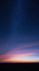 Stunning nighttime sky with vibrant sunset and starry horizon