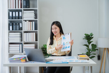 Asian Woman Presenting Business Data
