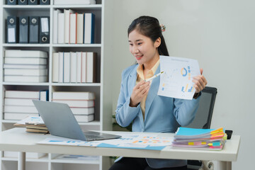 Asian Woman Presenting Business Data Online