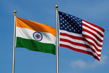 Indian and American flags flying side by side under a blue sky, symbolizing diplomatic relations, partnership, and international cooperation.