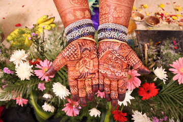 mehndi an art on hands of a bride in Indian tradition
