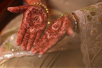 mehndi an art on hands of a bride in Indian tradition