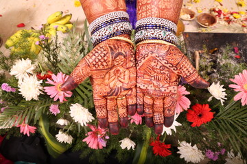 mehndi an art on hands of a bride in Indian tradition